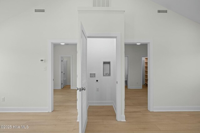 1615 Live Oak St Unit A & B, Beaufort, NC 28516 - corridor featuring light wood finished floors, visible vents, and high vaulted ceiling