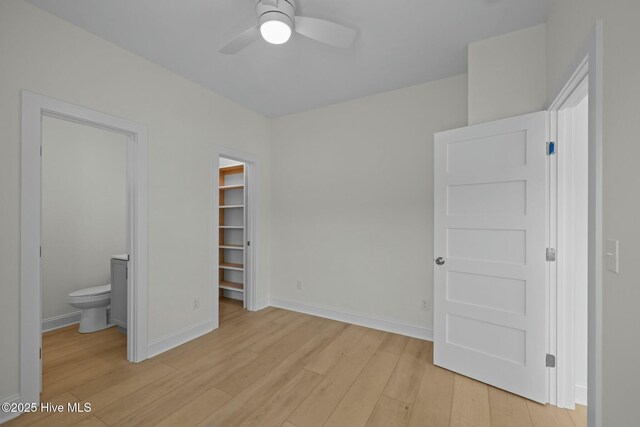 1615 Live Oak St Unit A & B, Beaufort, NC 28516 - unfurnished bedroom with a spacious closet, light wood-style flooring, connected bathroom, and baseboards