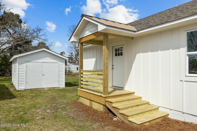1615 Live Oak St Unit A & B, Beaufort, NC 28516 - doorway to property featuring a yard, board and batten siding, and roof with shingles