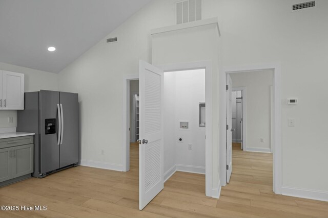 1615 Live Oak St Unit A & B, Beaufort, NC 28516 - kitchen with light wood finished floors, visible vents, stainless steel fridge, and light countertops