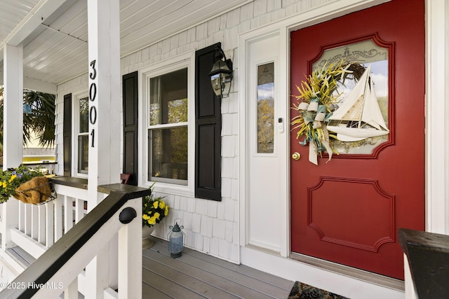 3001 E Yacht Dr, Oak Island, NC 28465 - view of exterior entry with a porch