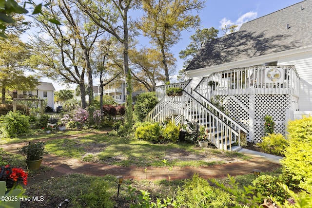 3001 E Yacht Dr, Oak Island, NC 28465 - view of yard with a deck and stairway