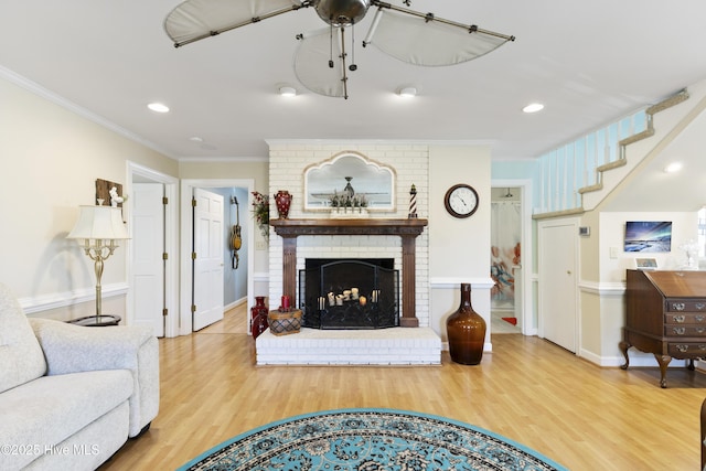 3001 E Yacht Dr, Oak Island, NC 28465 - living area with baseboards, ornamental molding, a fireplace, recessed lighting, and wood finished floors