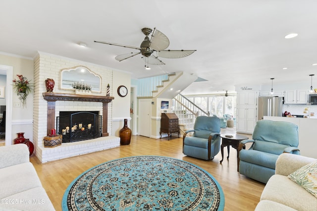 3001 E Yacht Dr, Oak Island, NC 28465 - living area with light wood-style flooring, ornamental molding, and a ceiling fan