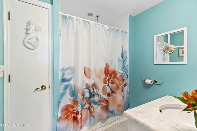 3001 E Yacht Dr, Oak Island, NC 28465 - bathroom featuring curtained shower and vanity