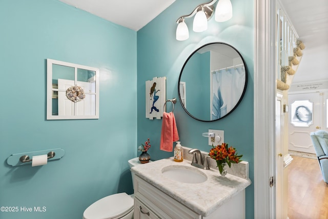 3001 E Yacht Dr, Oak Island, NC 28465 - full bath with vanity, toilet, and wood finished floors