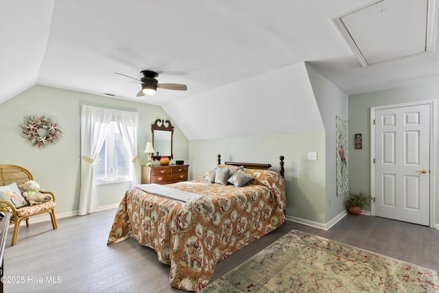 3001 E Yacht Dr, Oak Island, NC 28465 - bedroom with baseboards, wood finished floors, and lofted ceiling