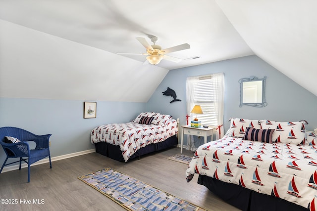 3001 E Yacht Dr, Oak Island, NC 28465 - bedroom featuring ceiling fan, vaulted ceiling, visible vents, wood finished floors, and baseboards