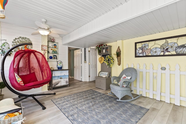 3001 E Yacht Dr, Oak Island, NC 28465 - living area with wood finished floors and a ceiling fan