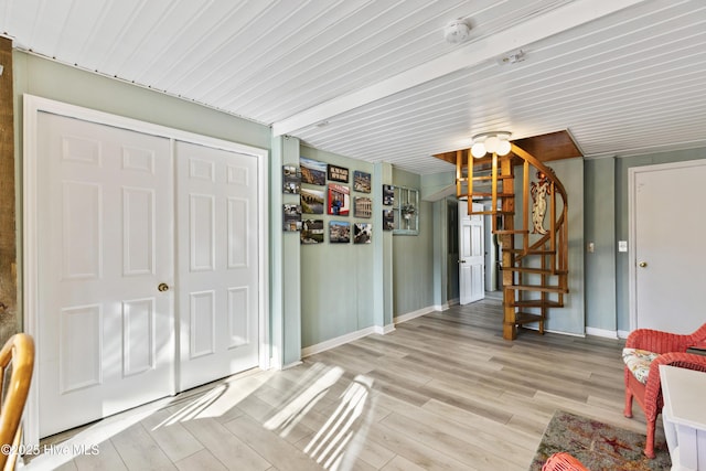 3001 E Yacht Dr, Oak Island, NC 28465 - living room with stairway, light wood-type flooring, and baseboards