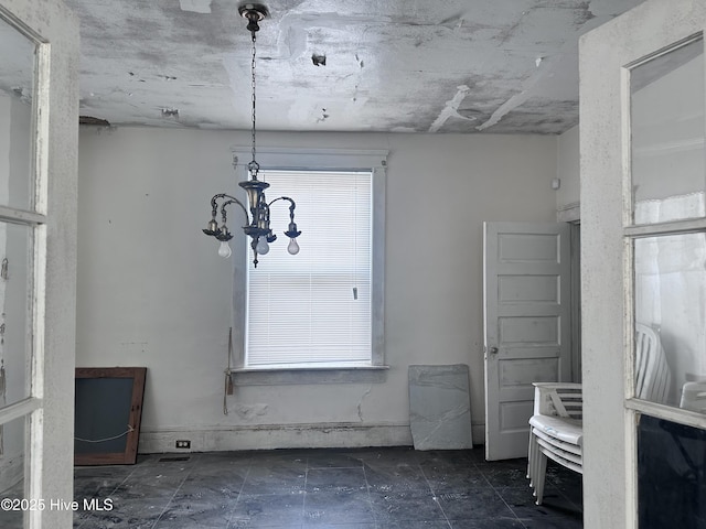 interior space with a notable chandelier