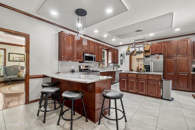 kitchen featuring backsplash, a peninsula, stainless steel appliances, and crown molding