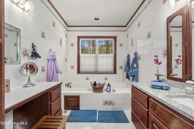 full bathroom featuring tile patterned floors, a bath, crown molding, and tile walls