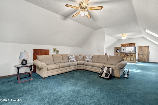 carpeted living area with a textured ceiling, vaulted ceiling, and a ceiling fan