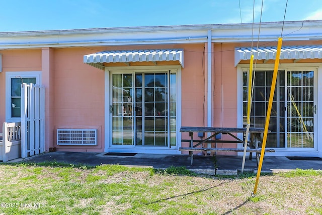 exterior space with a patio and concrete block siding