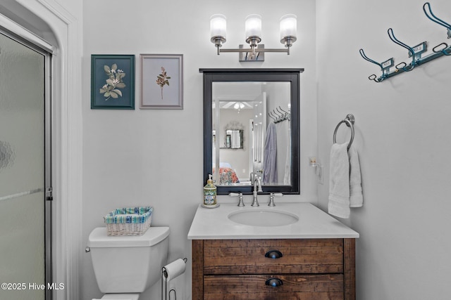 bathroom with toilet and vanity
