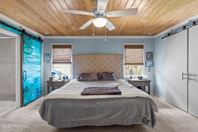 bedroom with a barn door, wooden ceiling, crown molding, and carpet