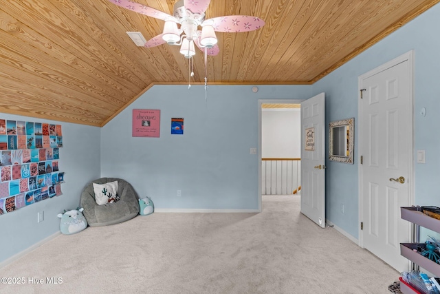 recreation room featuring baseboards, vaulted ceiling, a ceiling fan, carpet floors, and wood ceiling