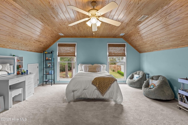 carpeted bedroom with visible vents, ceiling fan, multiple windows, and wooden ceiling