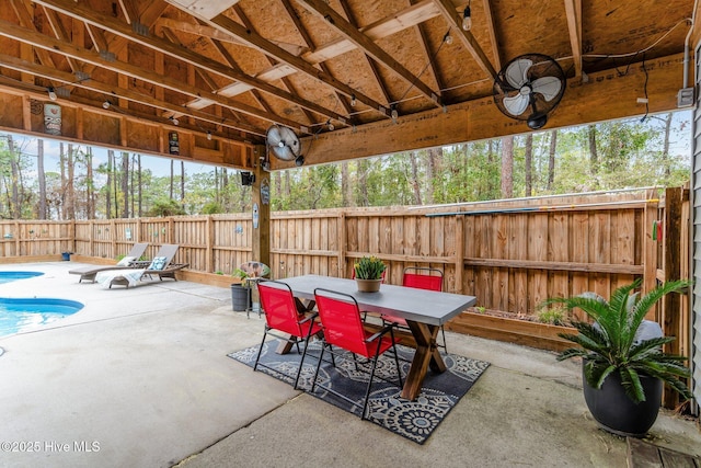 view of patio / terrace featuring a fenced in pool, outdoor dining area, and a fenced backyard