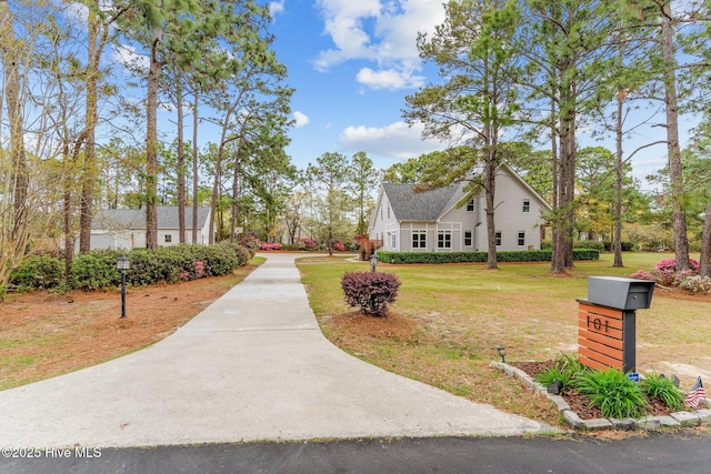 exterior space featuring a yard and driveway