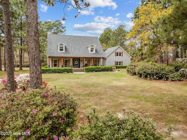 cape cod-style house with a front yard, a chimney, and a shingled roof