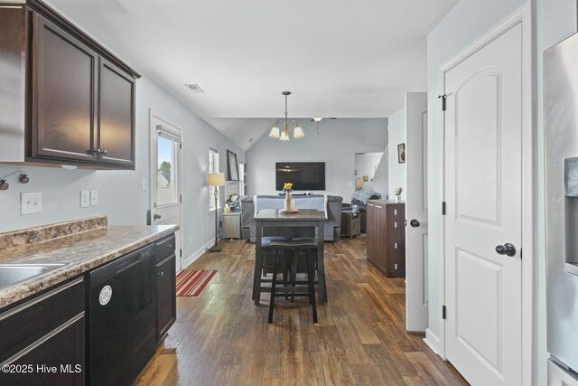 kitchen featuring dark brown cabinetry, a chandelier, black dishwasher, visible vents, and dark wood-style flooring