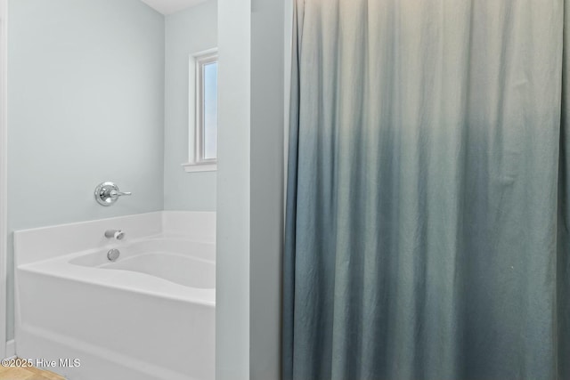 bathroom with a garden tub