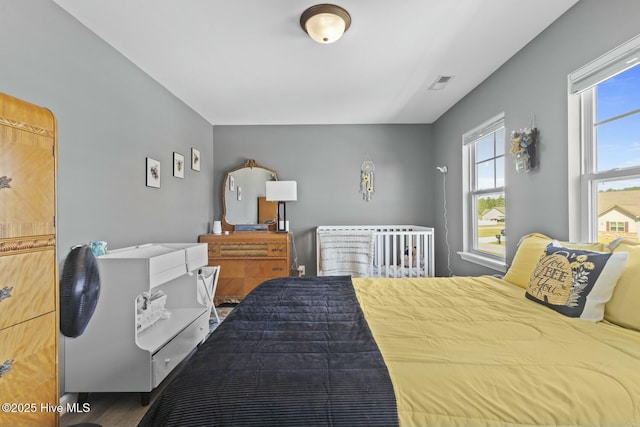 bedroom featuring visible vents