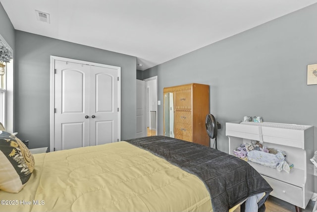 bedroom with visible vents and a closet