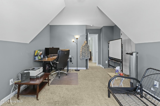 office area featuring carpet flooring, baseboards, and lofted ceiling