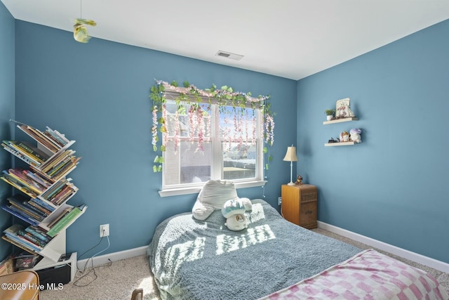 bedroom featuring baseboards, carpet floors, and visible vents