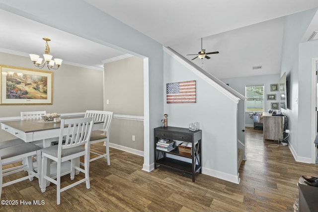dining area with ceiling fan with notable chandelier, wood finished floors, and baseboards