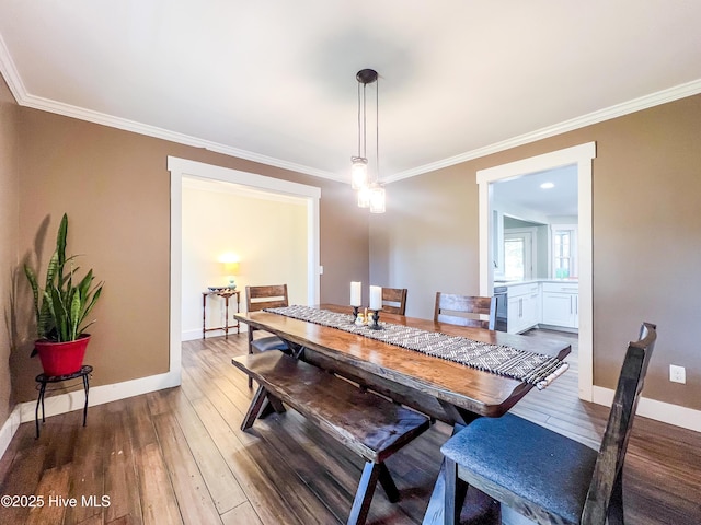 393 Knollwood Dr, Hampstead, NC 28443 - dining area with ornamental molding, wood-type flooring, and baseboards