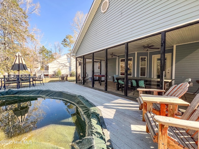 393 Knollwood Dr, Hampstead, NC 28443 - deck featuring outdoor dining area and ceiling fan