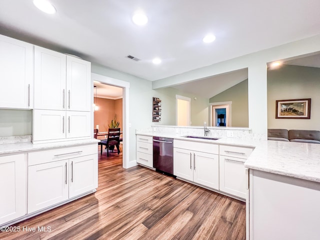 393 Knollwood Dr, Hampstead, NC 28443 - kitchen with dishwasher, a sink, light wood-type flooring, white cabinetry, and recessed lighting