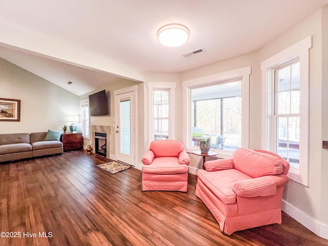 393 Knollwood Dr, Hampstead, NC 28443 - living room with wood finished floors, a tile fireplace, baseboards, and vaulted ceiling