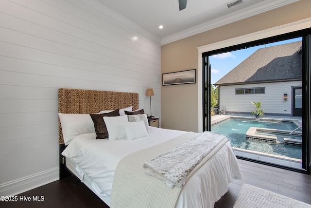 2941 Legends Dr, Southport, NC 28461 - bedroom with ornamental molding, wood finished floors, recessed lighting, wooden walls, and ceiling fan