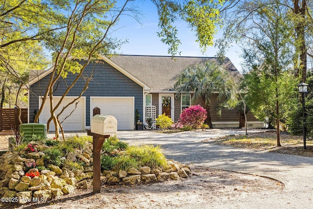 1817 Egret St SW, Shallotte, NC 28470 - view of front facade featuring an attached garage, gravel driveway, and roof with shingles