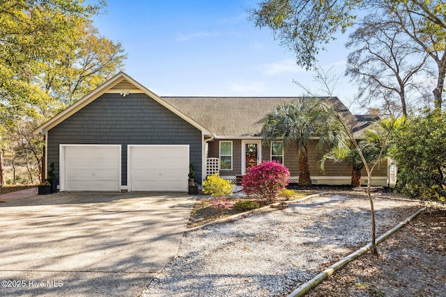 1817 Egret St SW, Shallotte, NC 28470 - view of front of home with an attached garage, a shingled roof, and concrete driveway