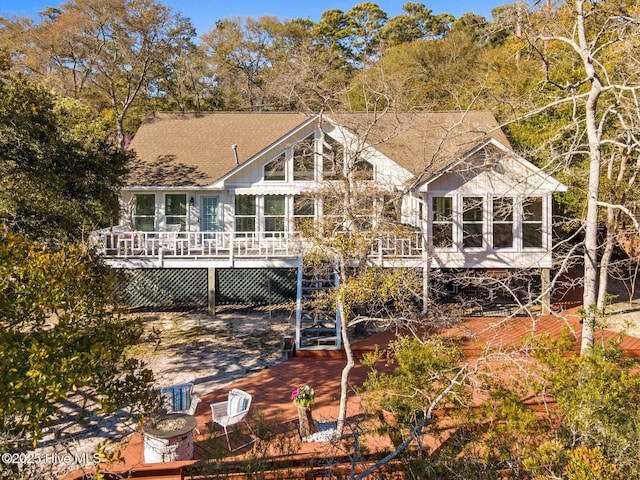 1817 Egret St SW, Shallotte, NC 28470 - rear view of house featuring a deck and roof with shingles
