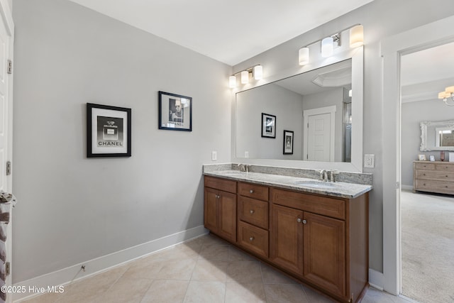 1025 Anchors Bend Way, Wilmington, NC 28411 - full bathroom featuring double vanity, baseboards, and tile patterned floors