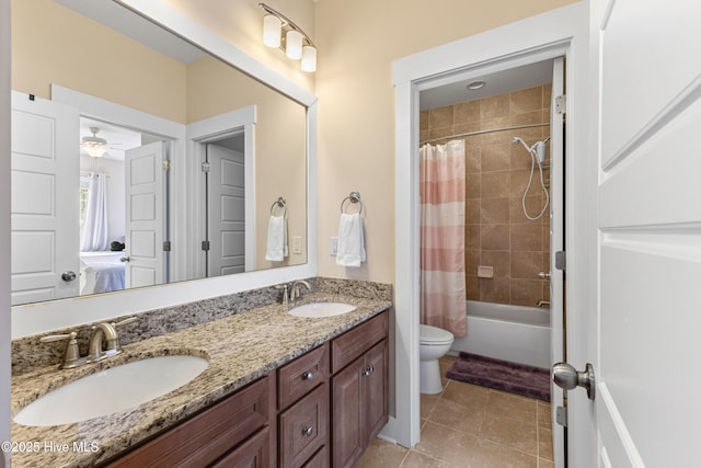 1025 Anchors Bend Way, Wilmington, NC 28411 - bathroom featuring toilet, double vanity, tile patterned floors, shower / tub combo, and a ceiling fan