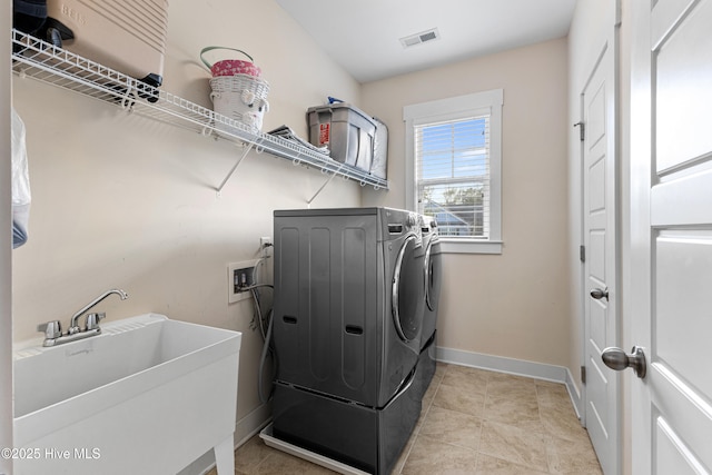 1025 Anchors Bend Way, Wilmington, NC 28411 - laundry room with independent washer and dryer, baseboards, pet washing station, and light tile patterned floors
