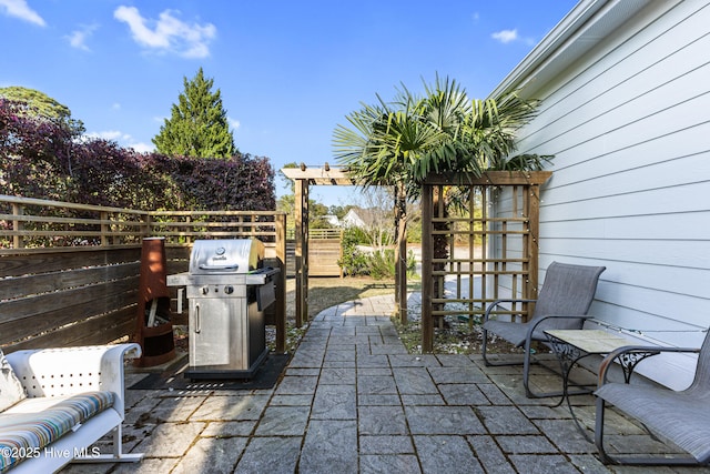 1025 Anchors Bend Way, Wilmington, NC 28411 - fenced backyard with a grill and a patio area