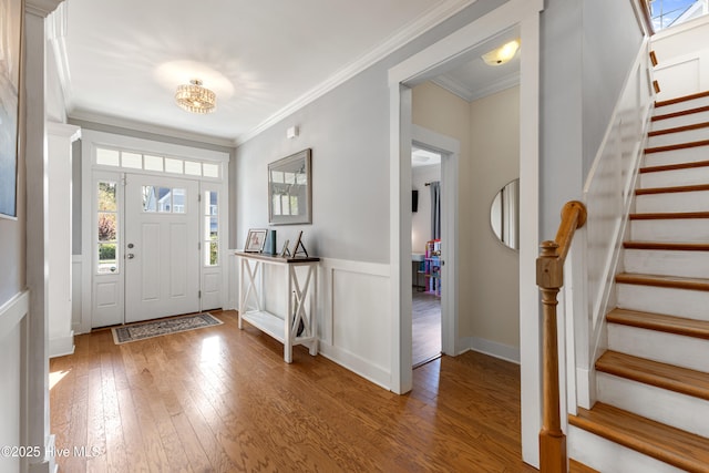 1025 Anchors Bend Way, Wilmington, NC 28411 - foyer featuring hardwood / wood-style floors, stairway, ornamental molding, a wainscoted wall, and a decorative wall