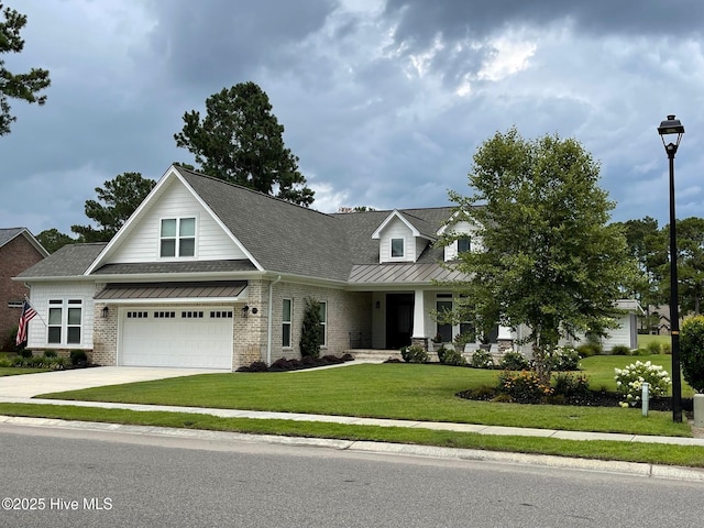 1325 Grandiflora Dr, Leland, NC 28451 - view of front of house with concrete driveway, roof with shingles, an attached garage, a front lawn, and brick siding