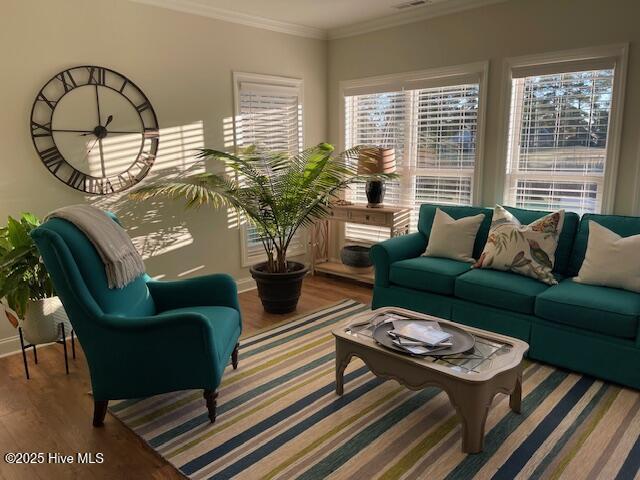 1325 Grandiflora Dr, Leland, NC 28451 - living area with ornamental molding, baseboards, and wood finished floors