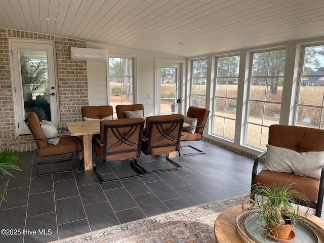 1325 Grandiflora Dr, Leland, NC 28451 - sunroom with tile patterned floors, wooden ceiling, a wall unit AC, lofted ceiling, and brick wall