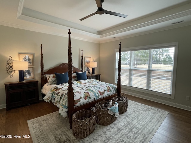 1325 Grandiflora Dr, Leland, NC 28451 - bedroom with a raised ceiling, ornamental molding, and wood finished floors
